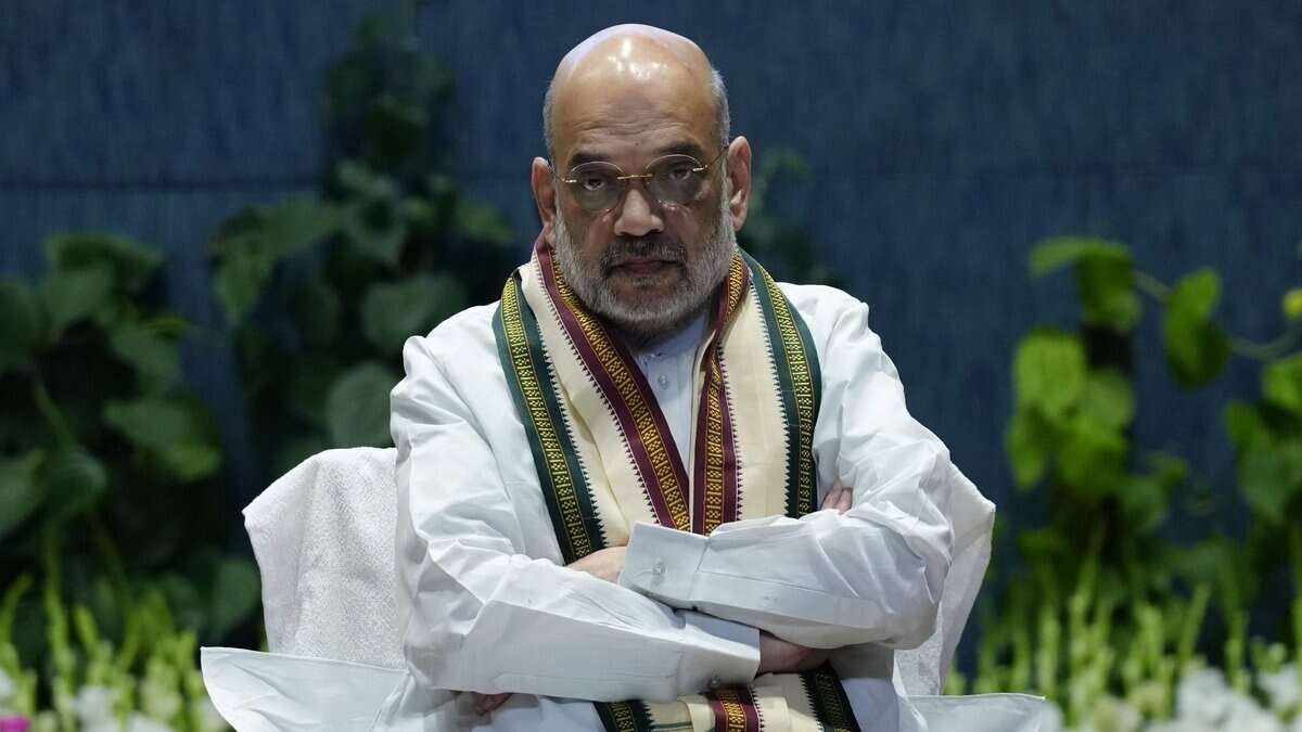 The image displays a picture of Union Home Minister Amit Shah